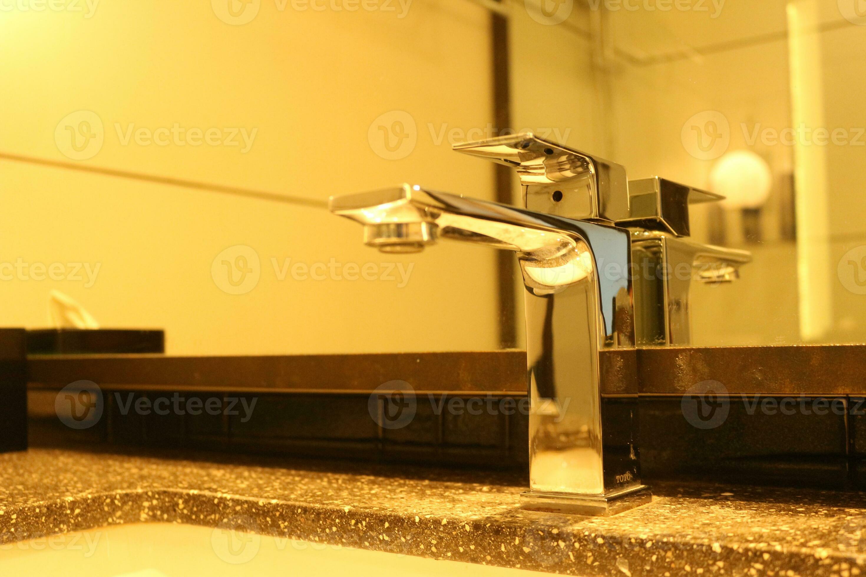 Elegant bathroom faucet with towels 27792428 Stock Photo at Vecteezy