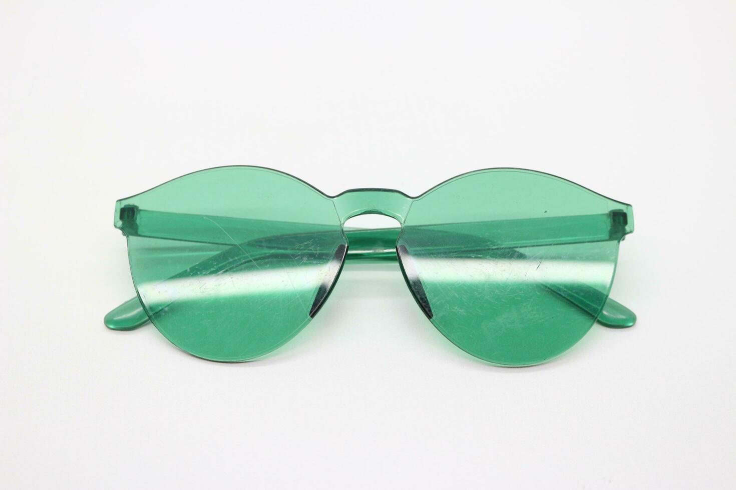 green glasses on the floor photo