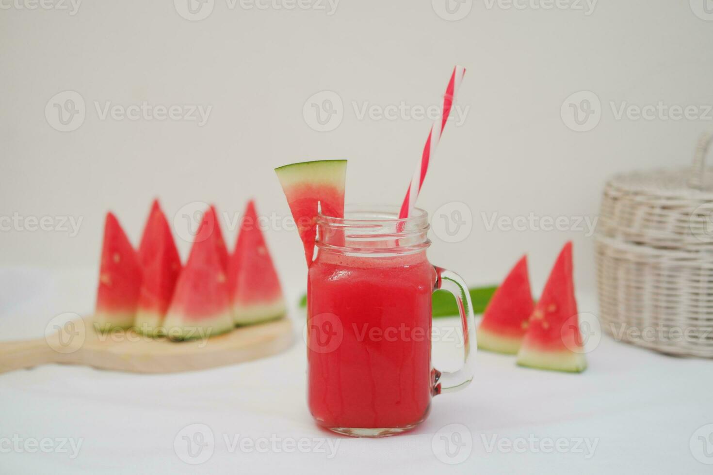 Watermelon smoothie in a glass jar with straws as a background photo