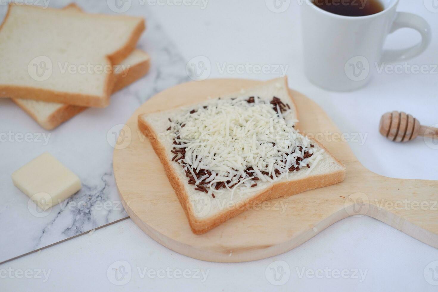 Breakfast with coffee, cheese and bread on white marble table. photo