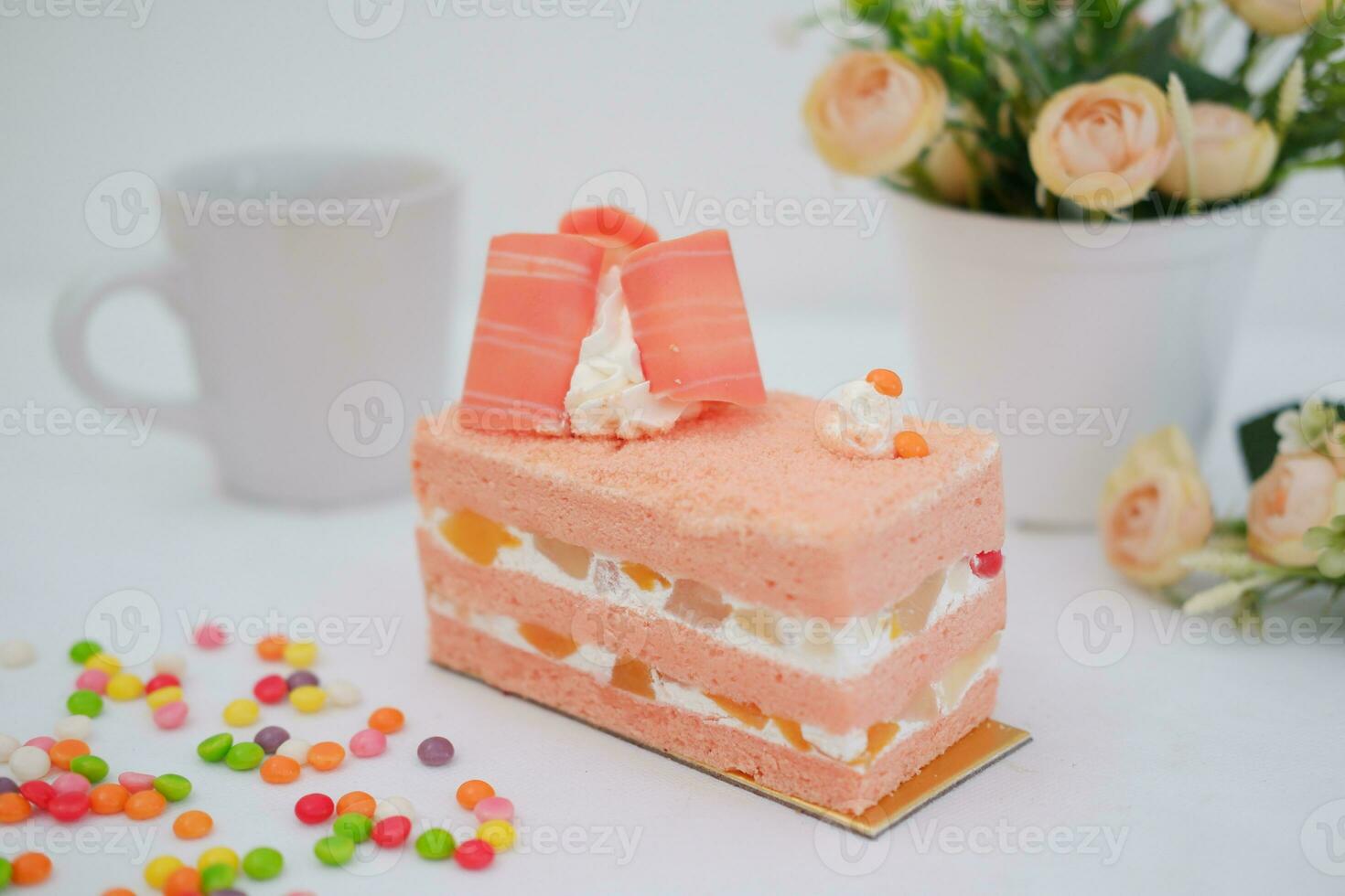 Slice of cake on white marble background. Selective focus. photo