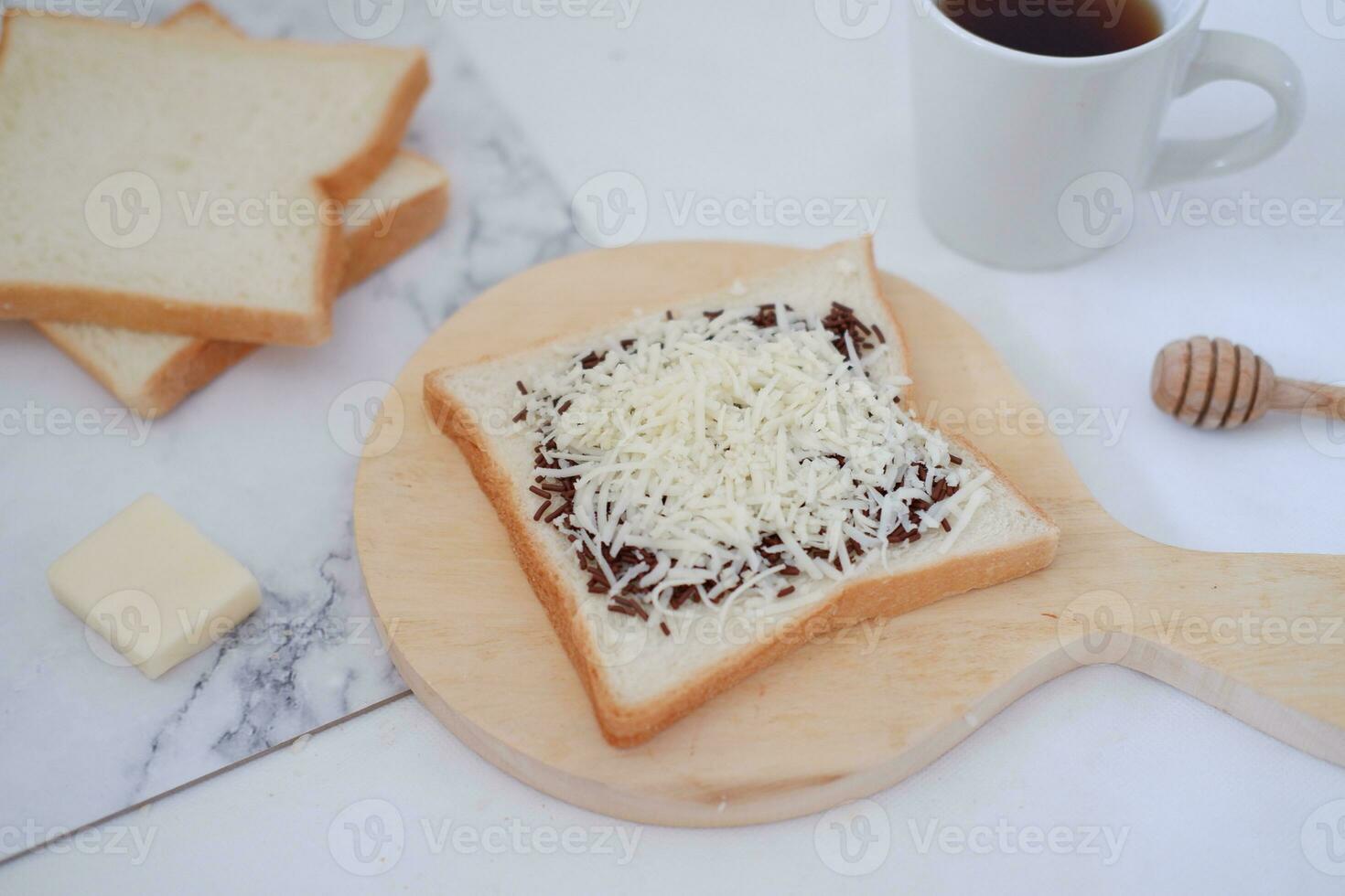 Breakfast with coffee, cheese and bread on white marble table. photo