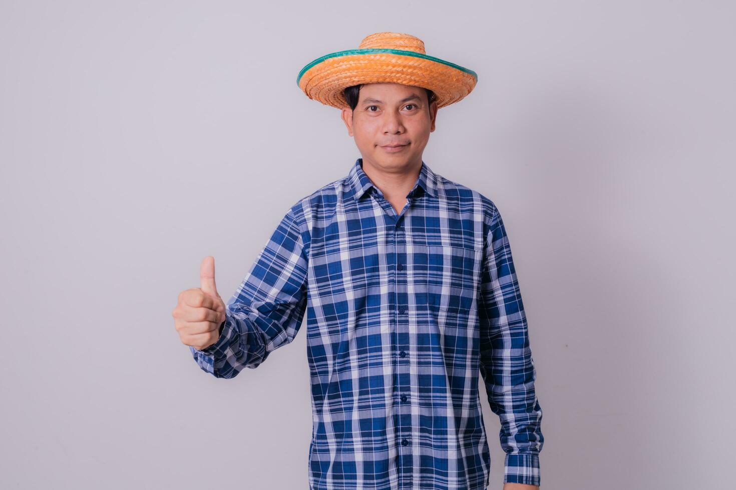 Asian farmer wearing striped shirt photo