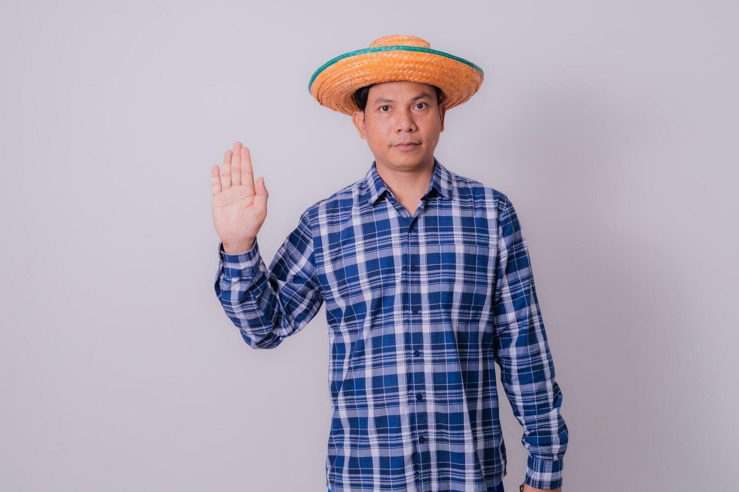 Asian farmer wearing striped shirt photo