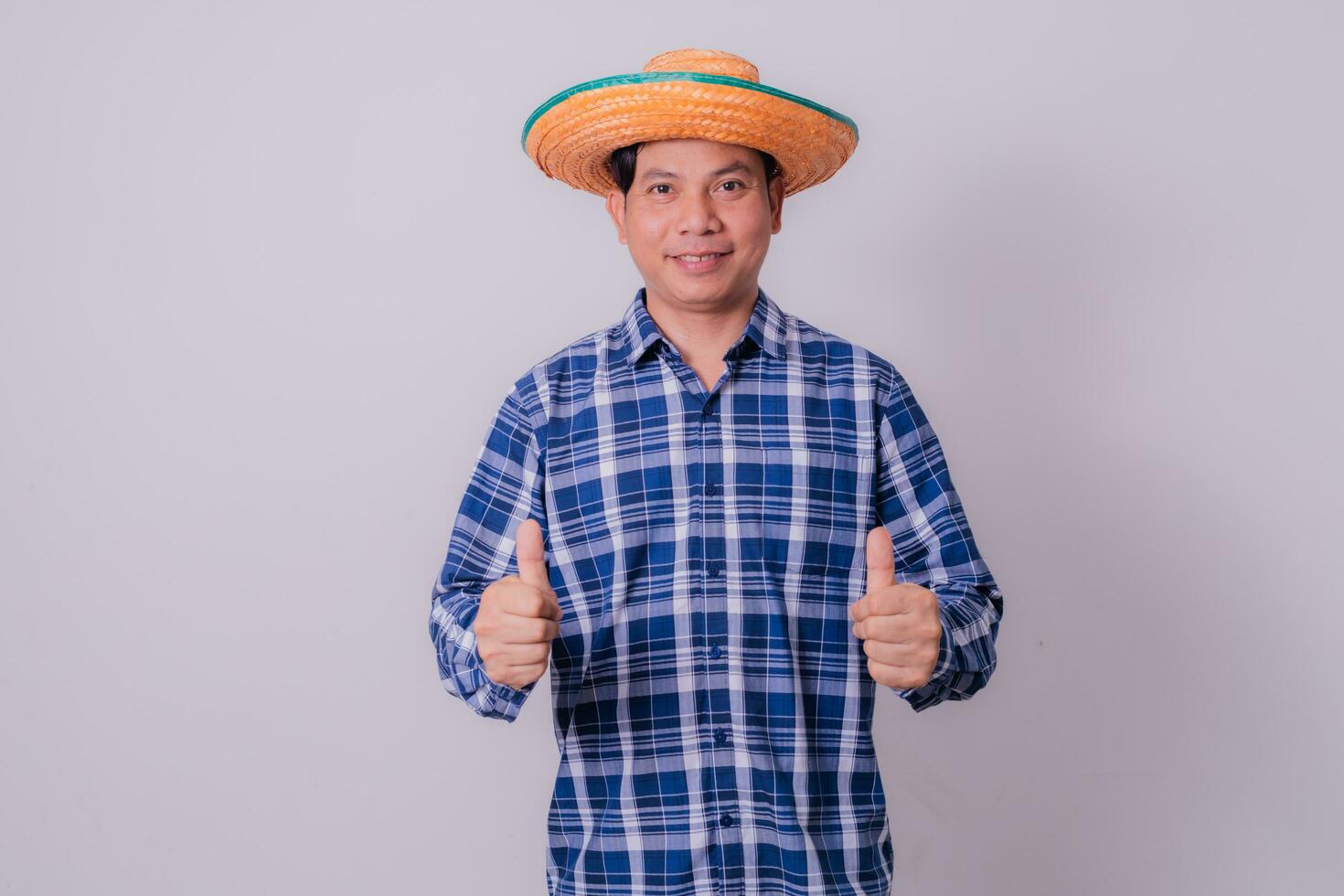 Asian farmer wearing striped shirt photo