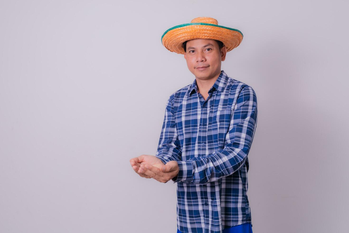 Asian farmer wearing striped shirt photo