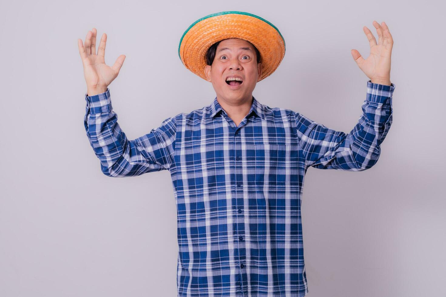 Asian farmer wearing striped shirt photo