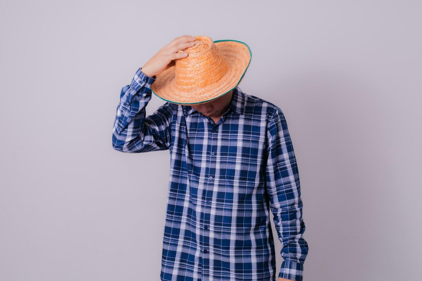Asian farmer wearing striped shirt photo