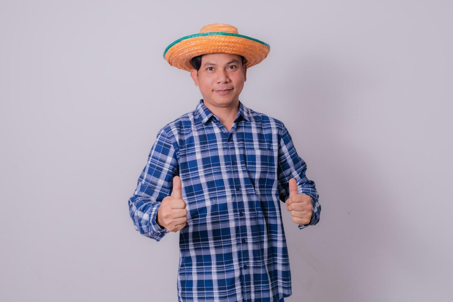 Asian farmer wearing striped shirt photo