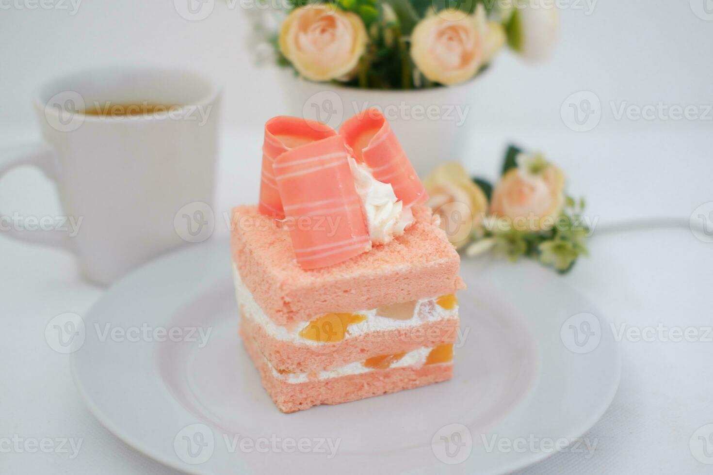 Slice of cake on white marble background. Selective focus. photo
