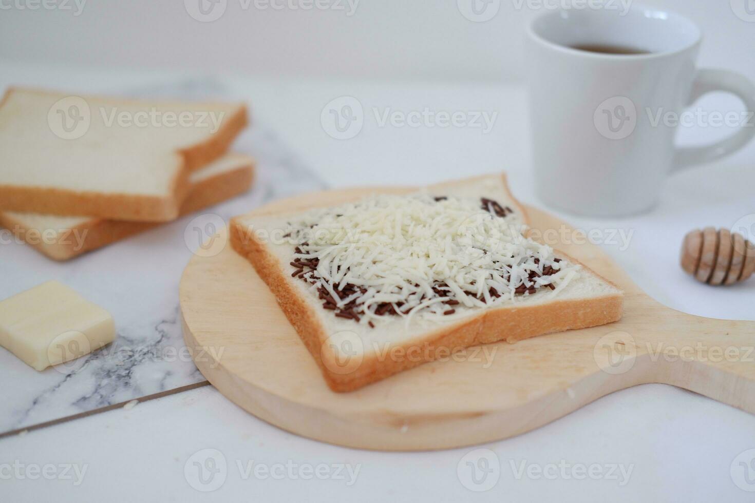 Breakfast with coffee, cheese and bread on white marble table. photo