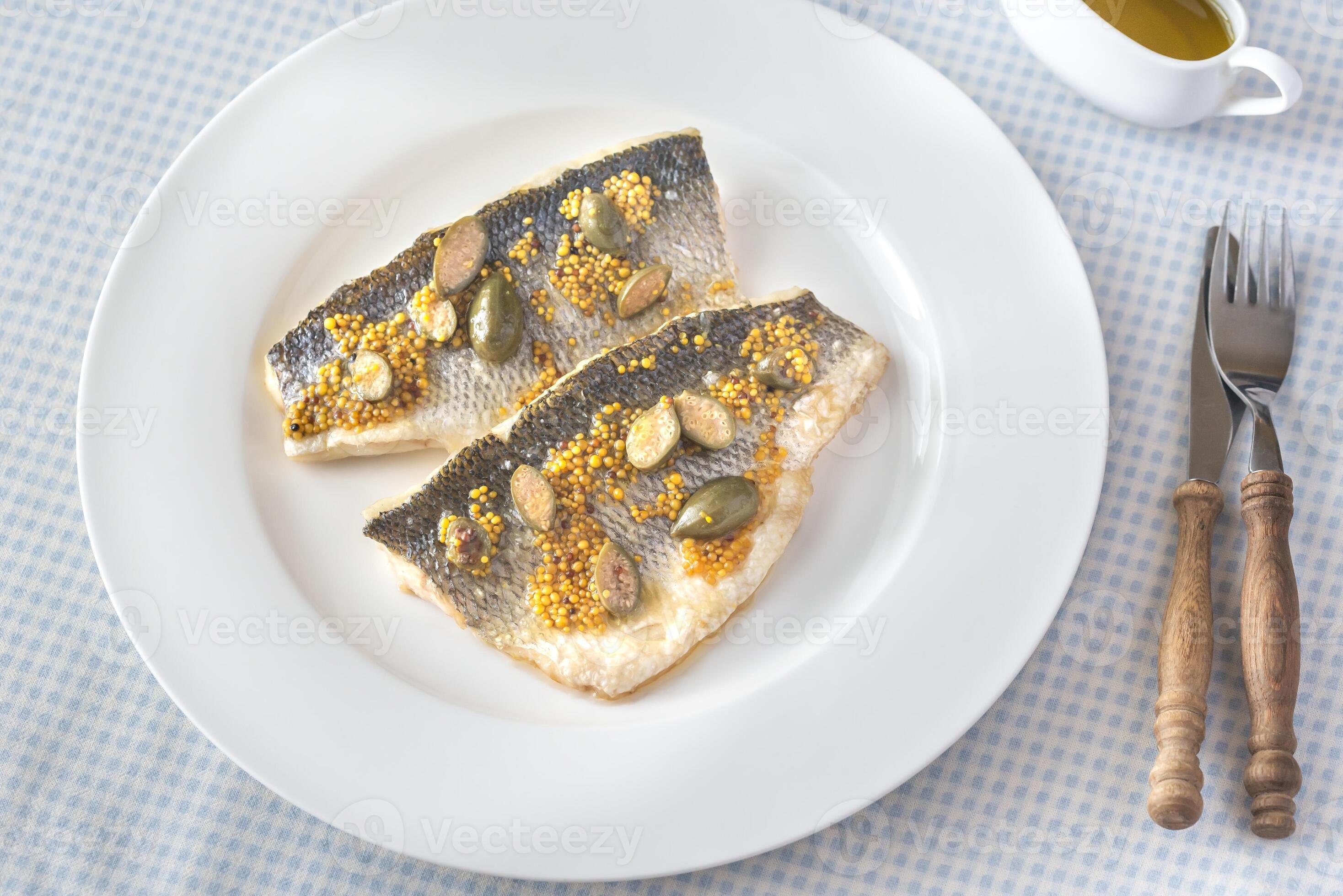 Baked sea bass with capers 27798996 Stock Photo at Vecteezy