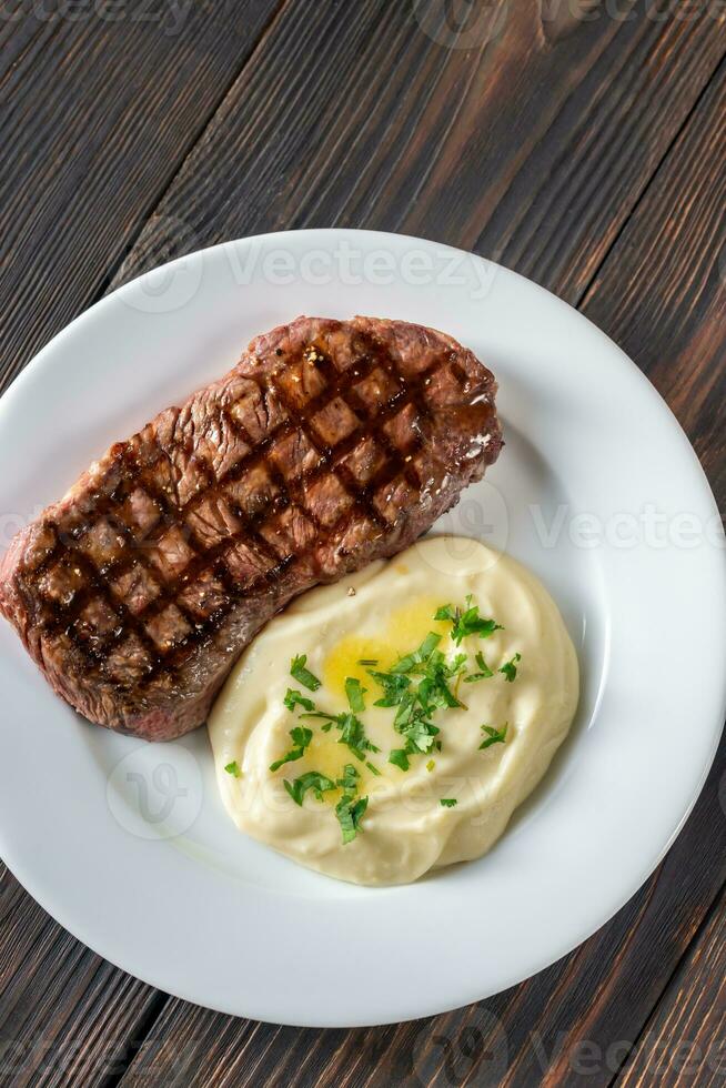 Strip steak with celery puree photo