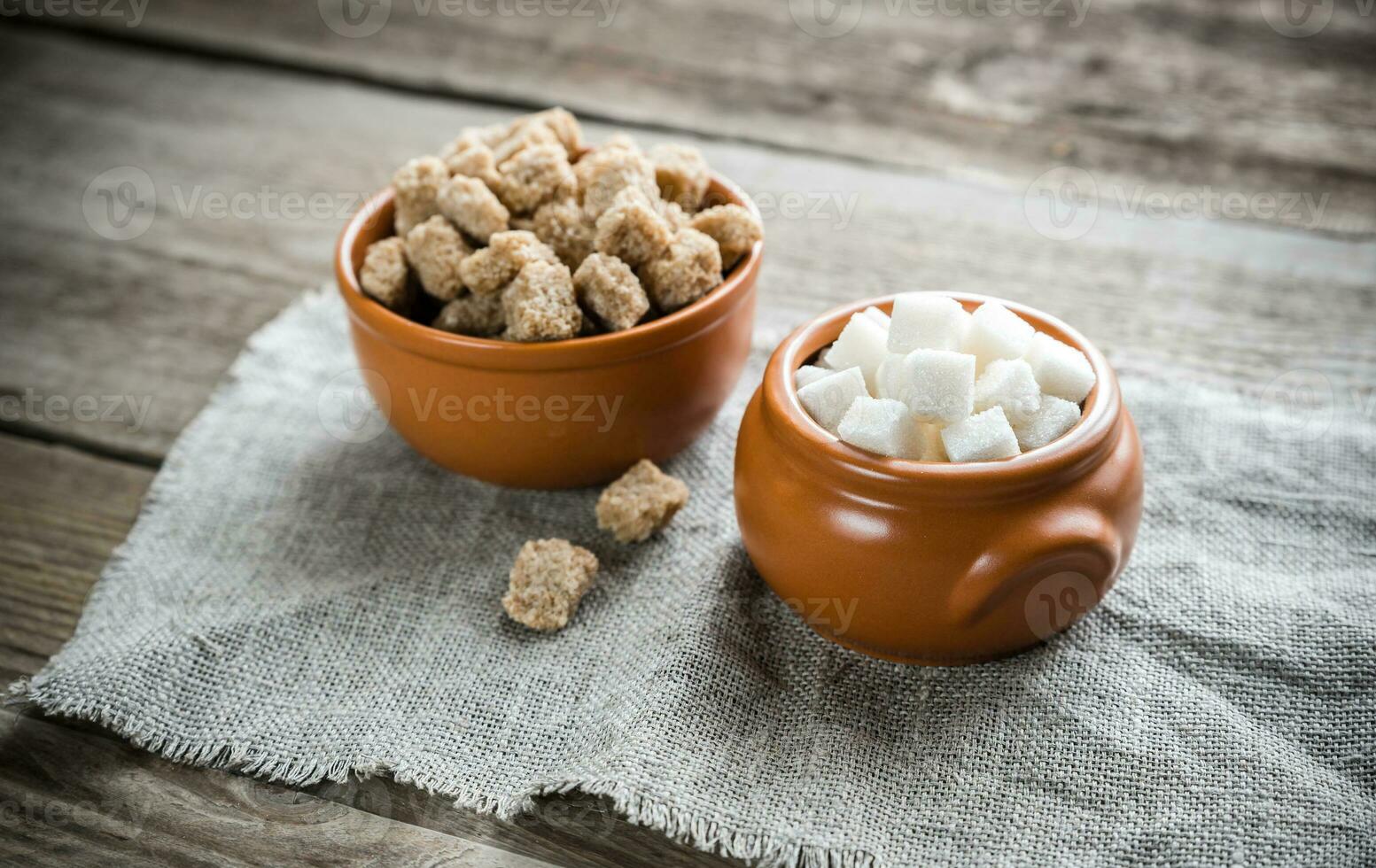 Bowls of white and brown sugar photo