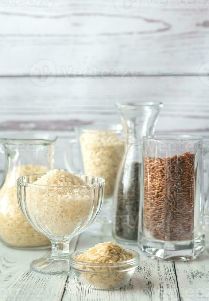 Different kinds of rice on the white background photo