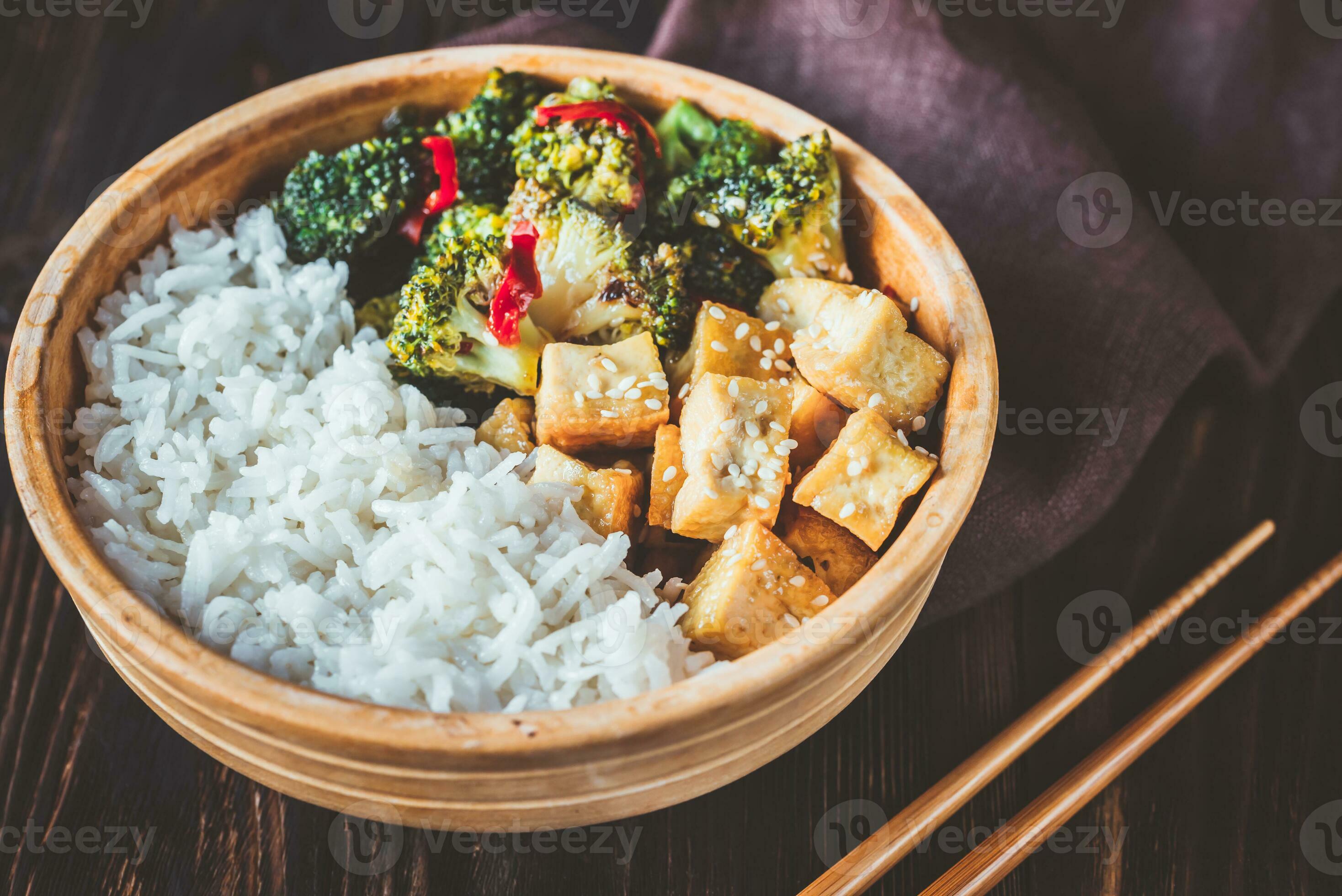 Tofu and broccoli stir-fry with white rice 27799919 Stock Photo at Vecteezy