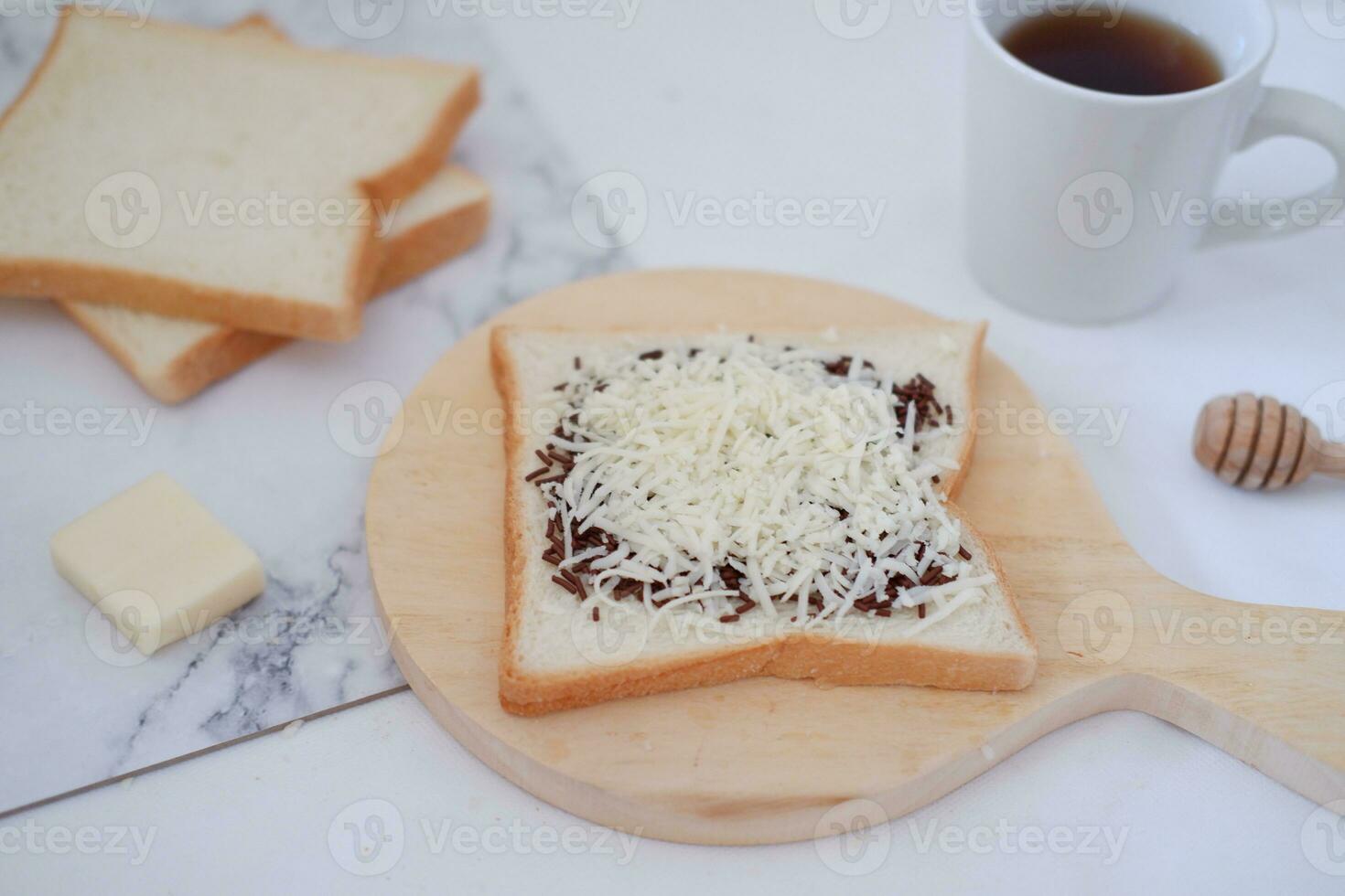 Breakfast with coffee, cheese and bread on white marble table. photo