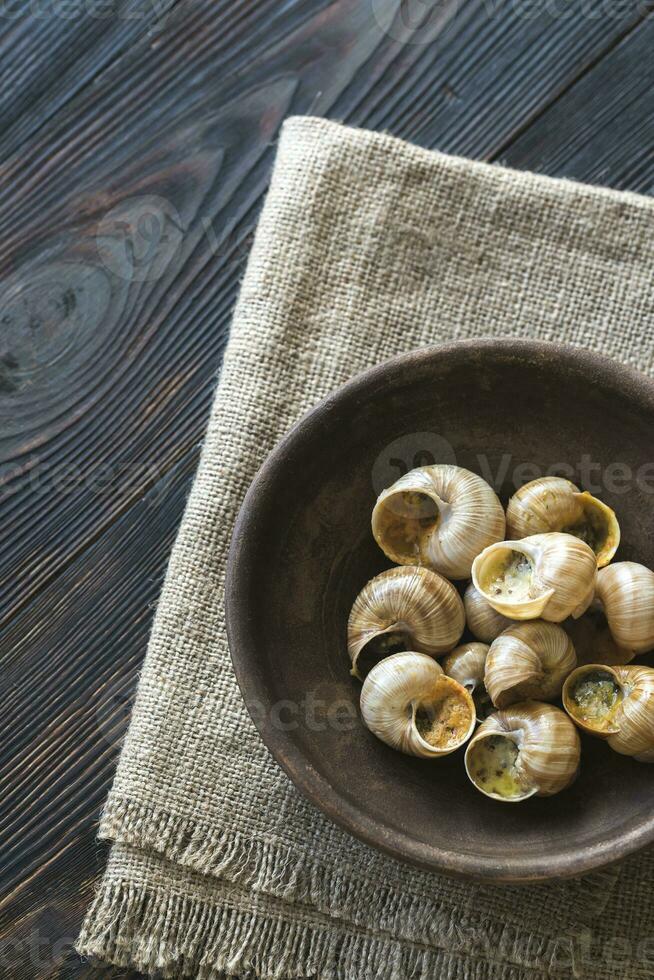 Bowl of cooked snails photo