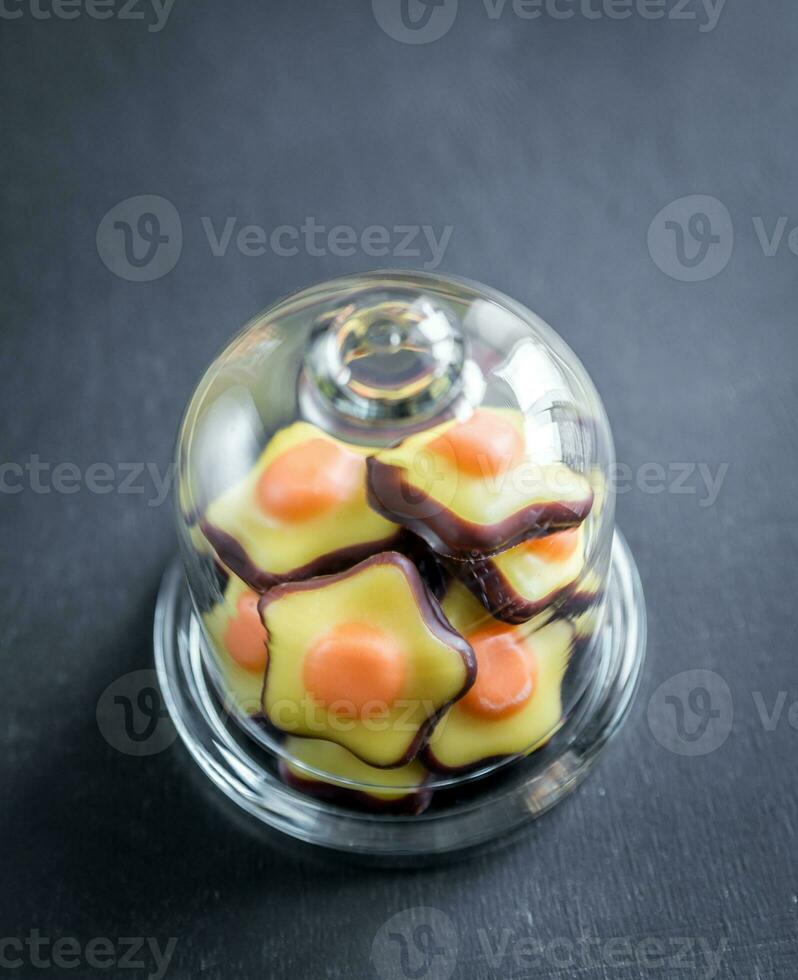 Fondant candies under the glass dome photo