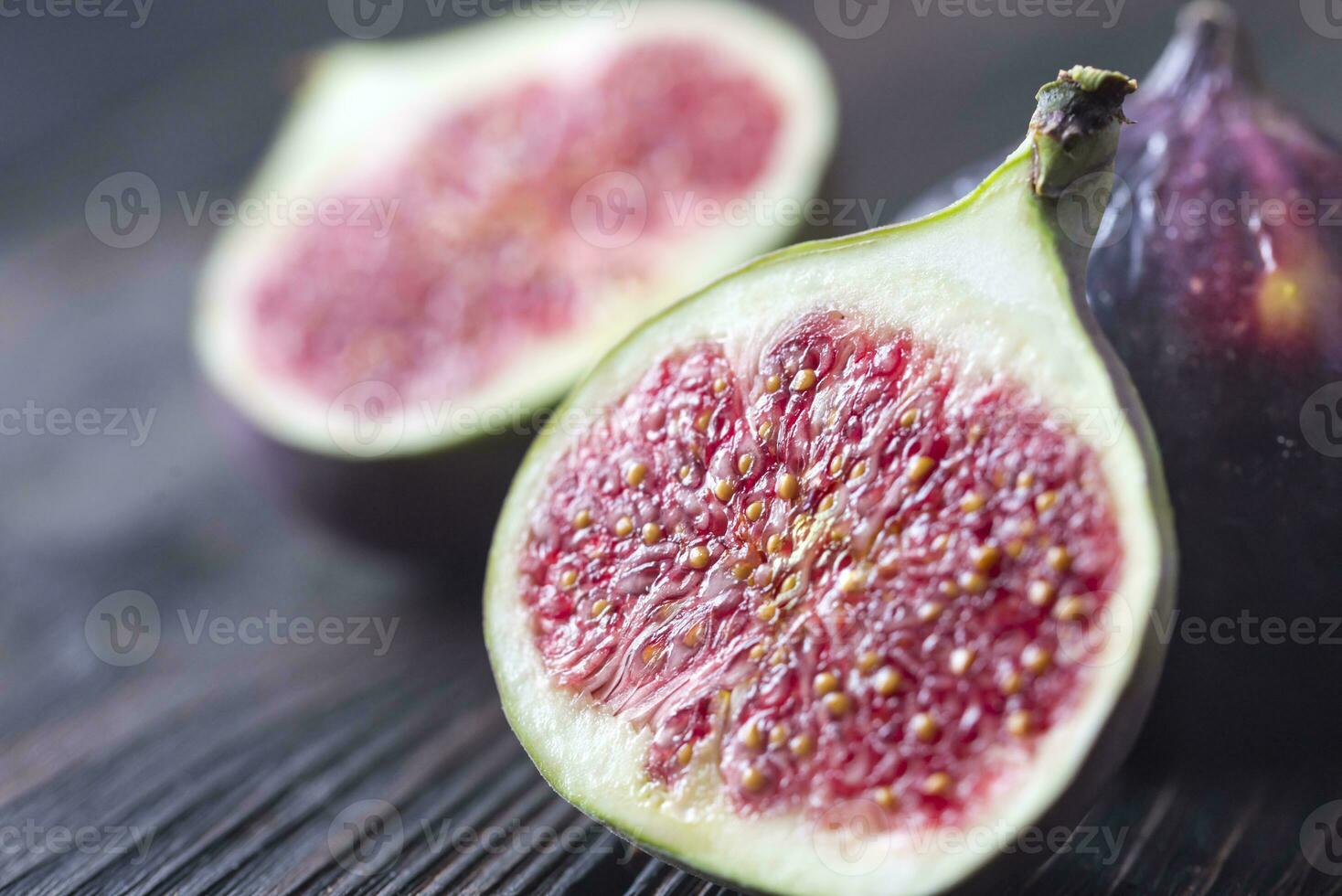 Fresh figs on the wooden background photo