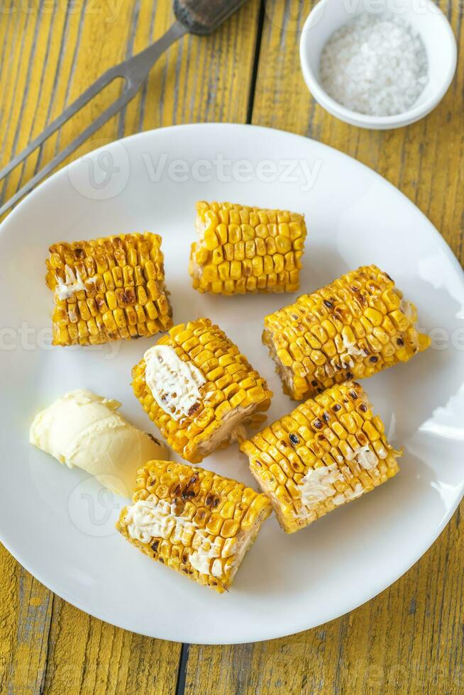 Grilled corn on the plate photo