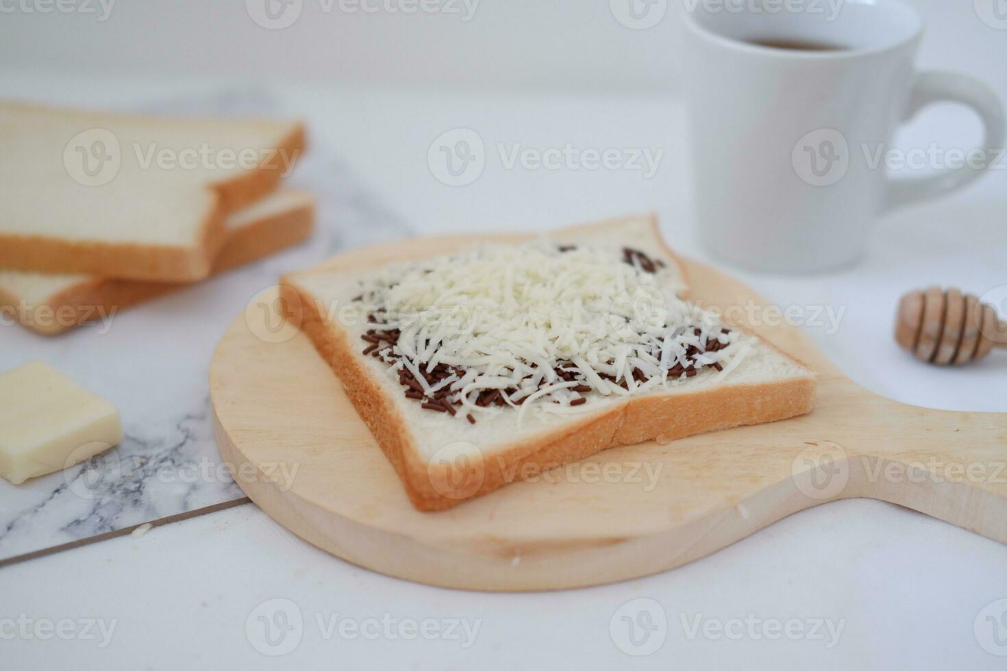 Breakfast with coffee, cheese and bread on white marble table. photo