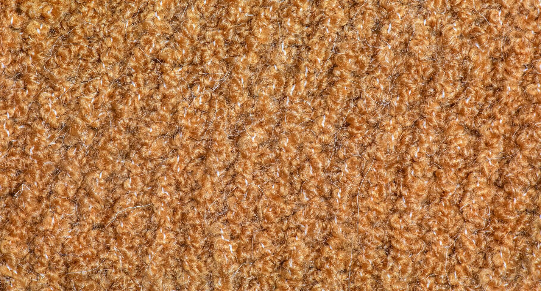 Knitted wool textile with background texture in light beige creamy brown shade. Beige color gradient on texture background. Scarf. photo