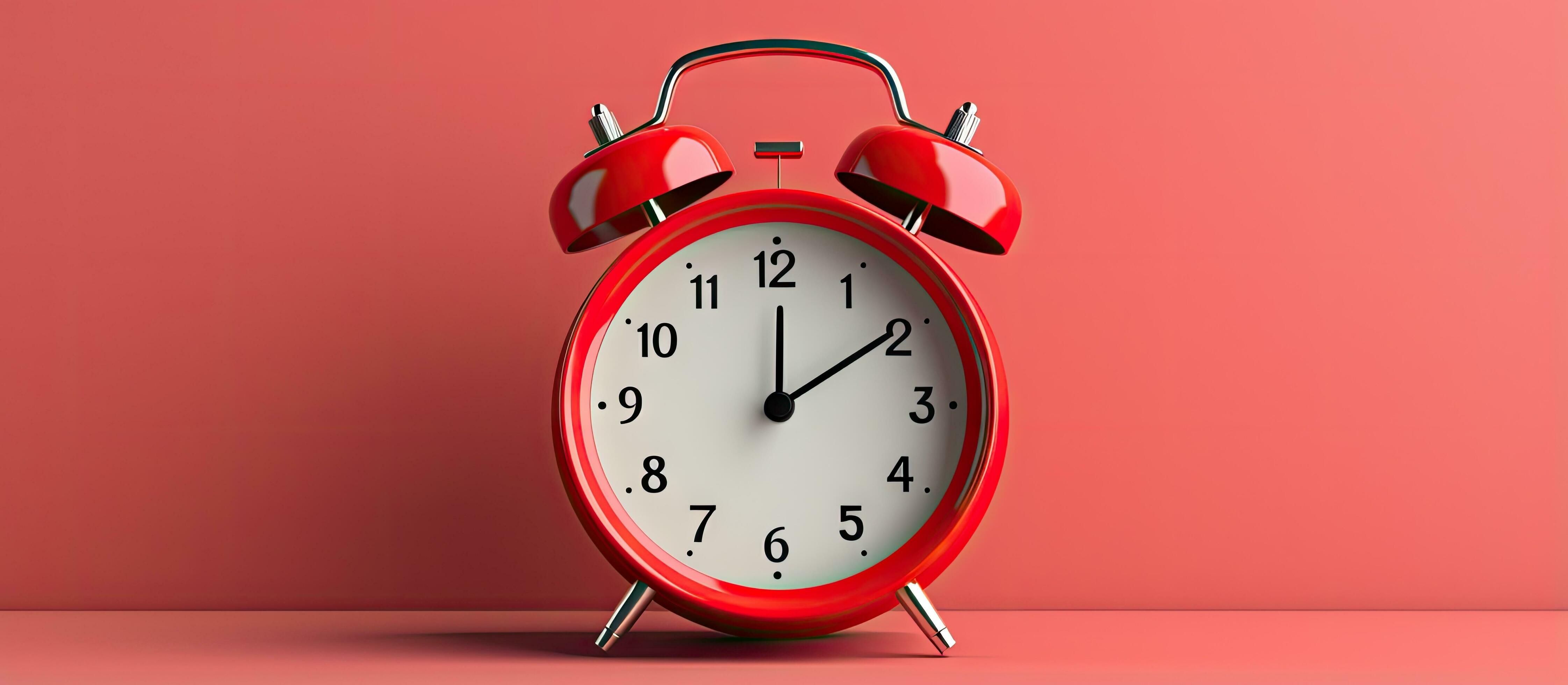 Red vintage alarm clock with no hands against a gray background Minimal