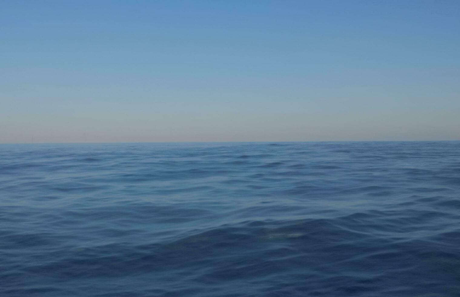 Blue water surface background photo