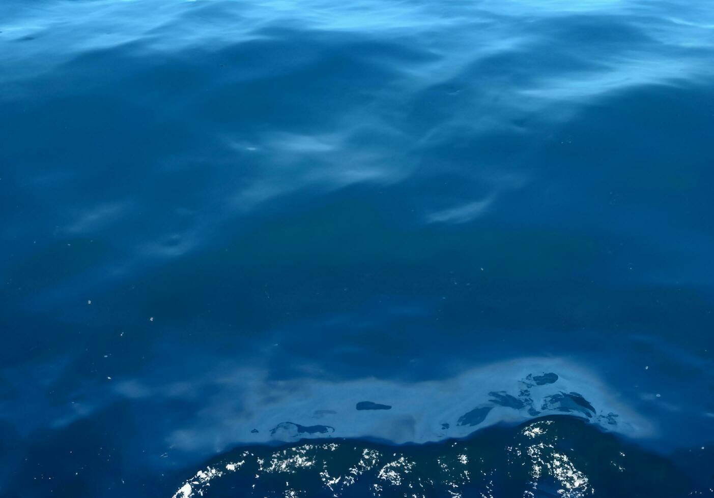 Blue water surface background photo