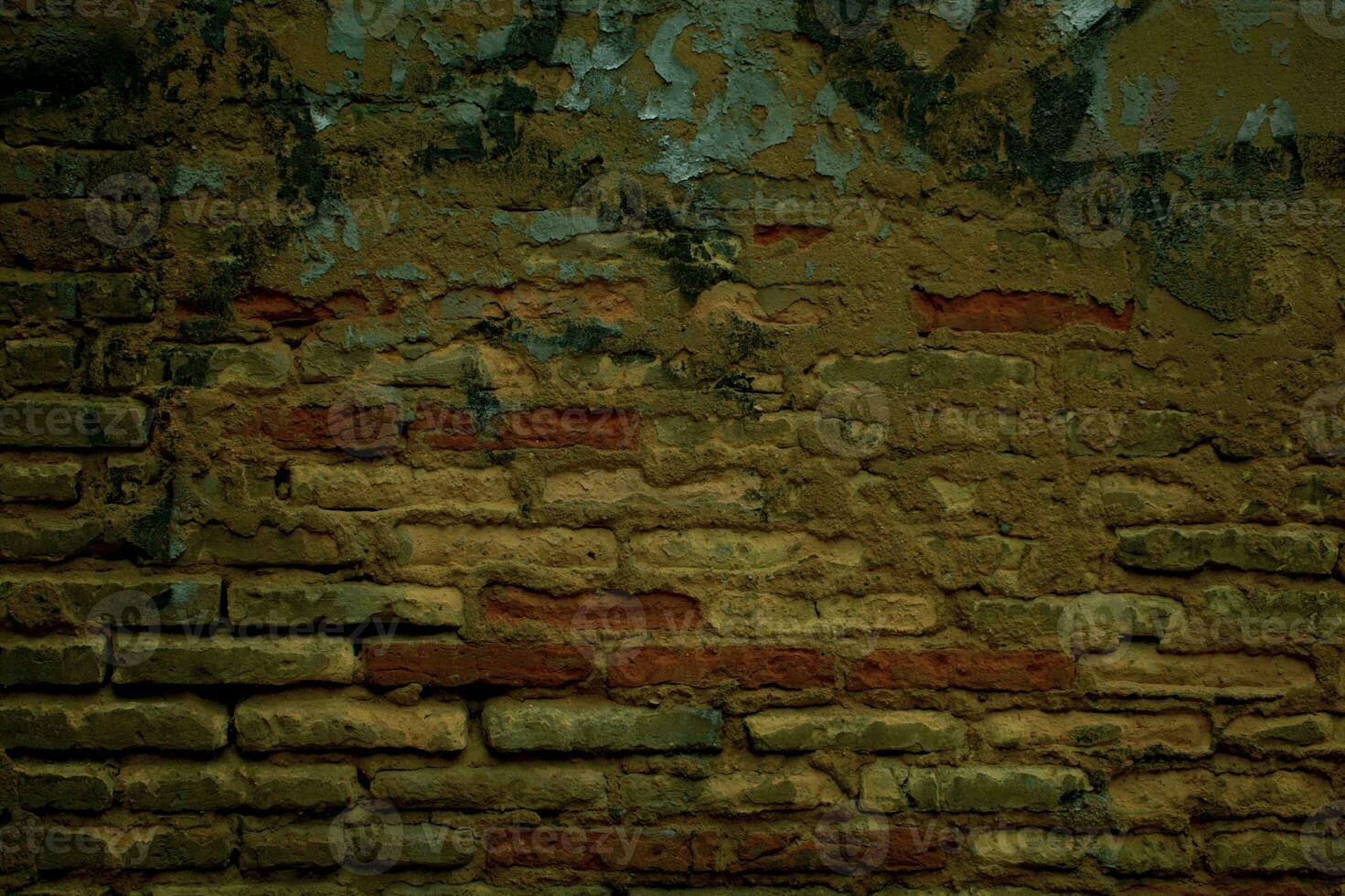 Old grunge weathered brick wall with graffiti photo
