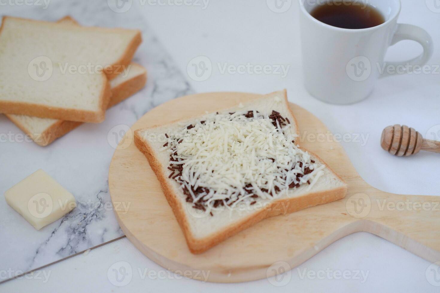 Breakfast with coffee, cheese and bread on white marble table. photo
