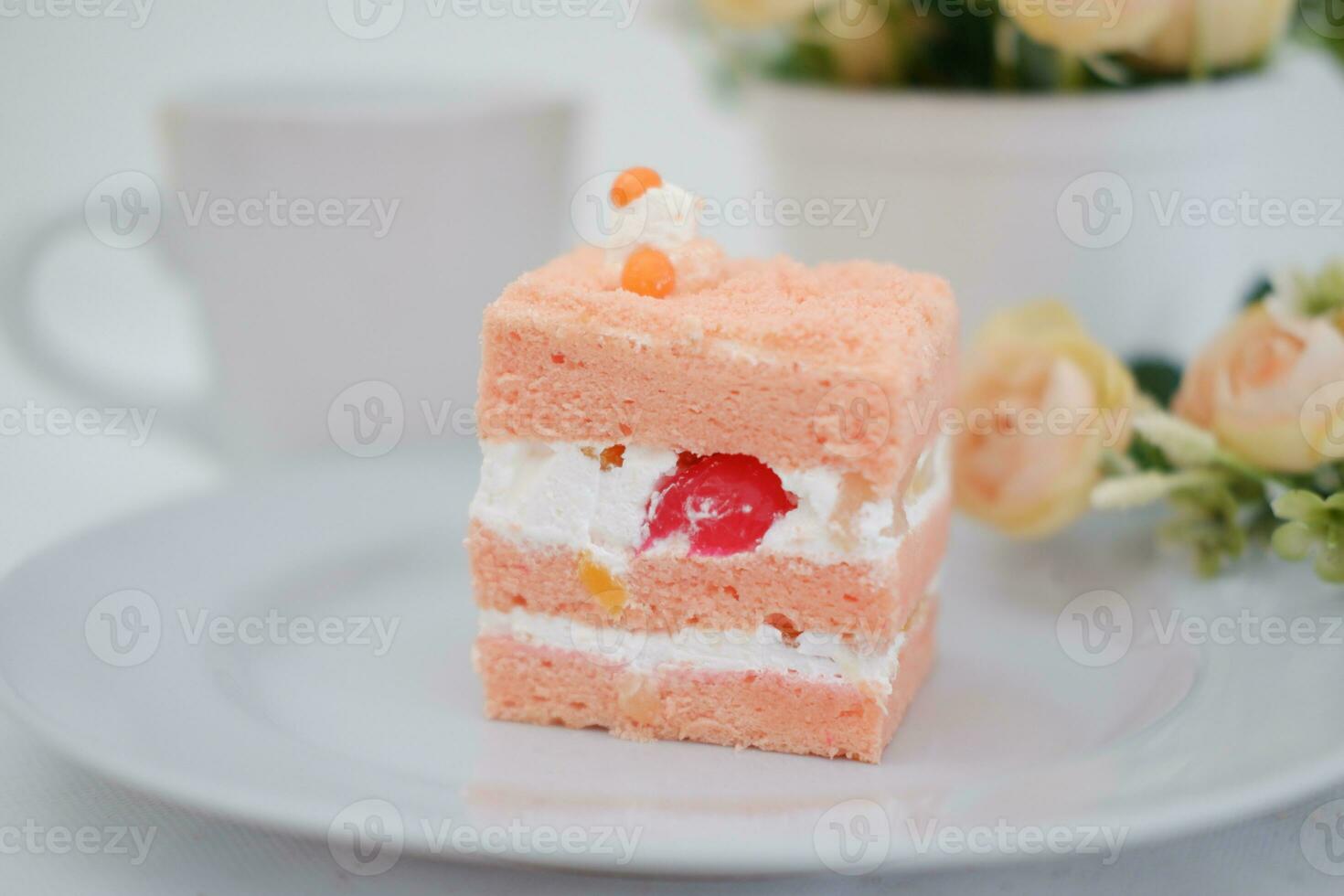 Slice of cake on white marble background. Selective focus. photo