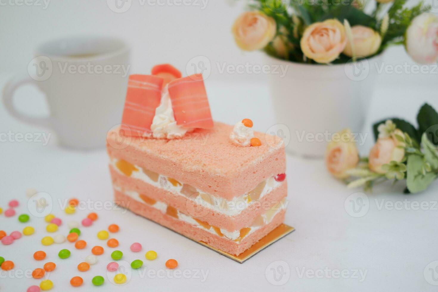 Slice of cake on white marble background. Selective focus. photo
