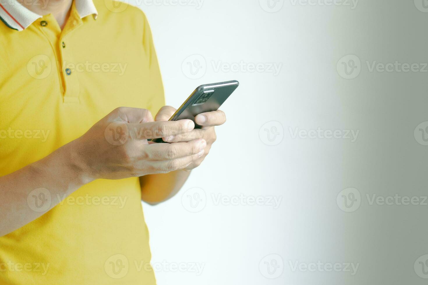 Man using mobile phone to chat with work over wireless network photo