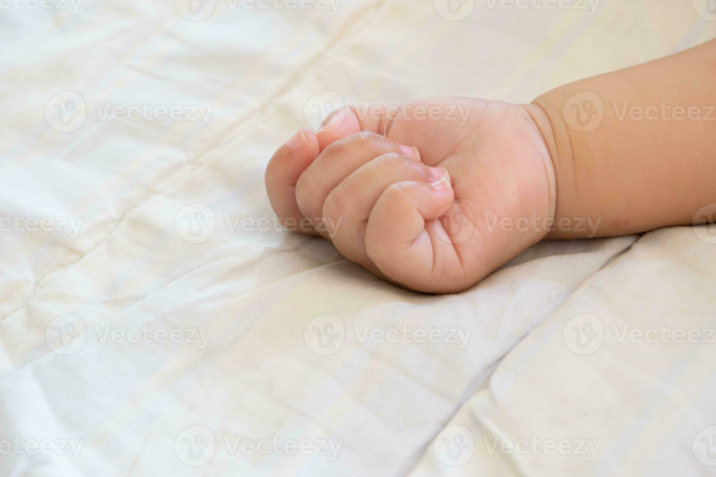 Baby hands sleeping on the bed 27806721 Stock Photo at Vecteezy
