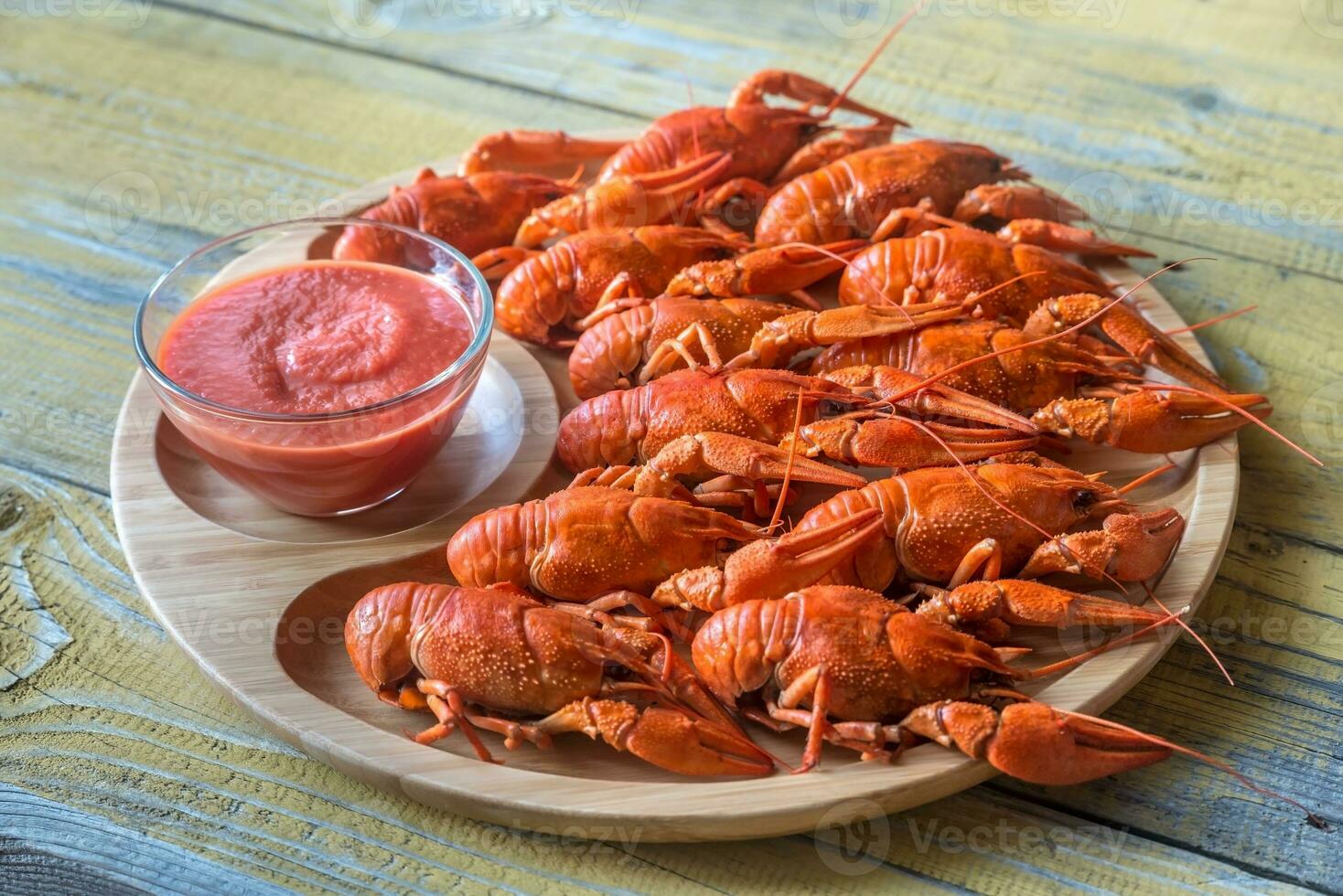 Dish of boiled crayfish with sauce photo