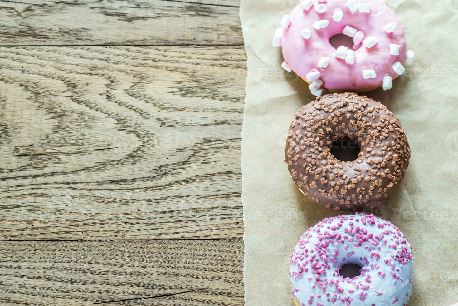 Colourful donuts arranged in a row photo