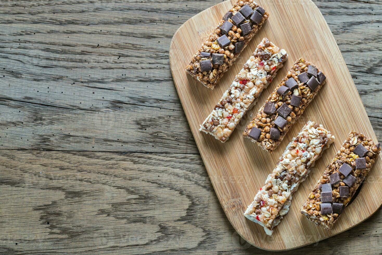 Granola bars with dried berries and chocolate photo