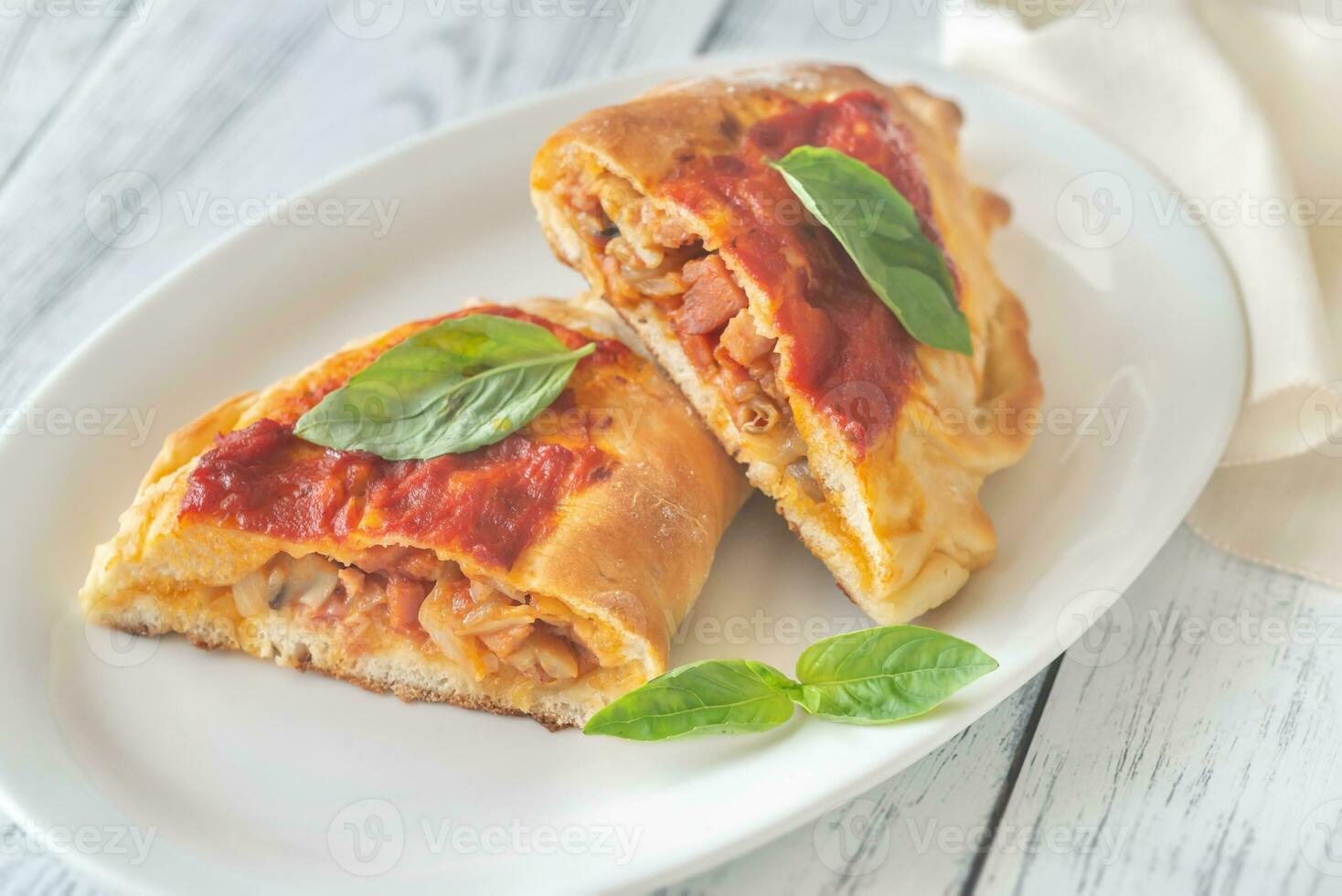 Homemade calzone on the plate photo
