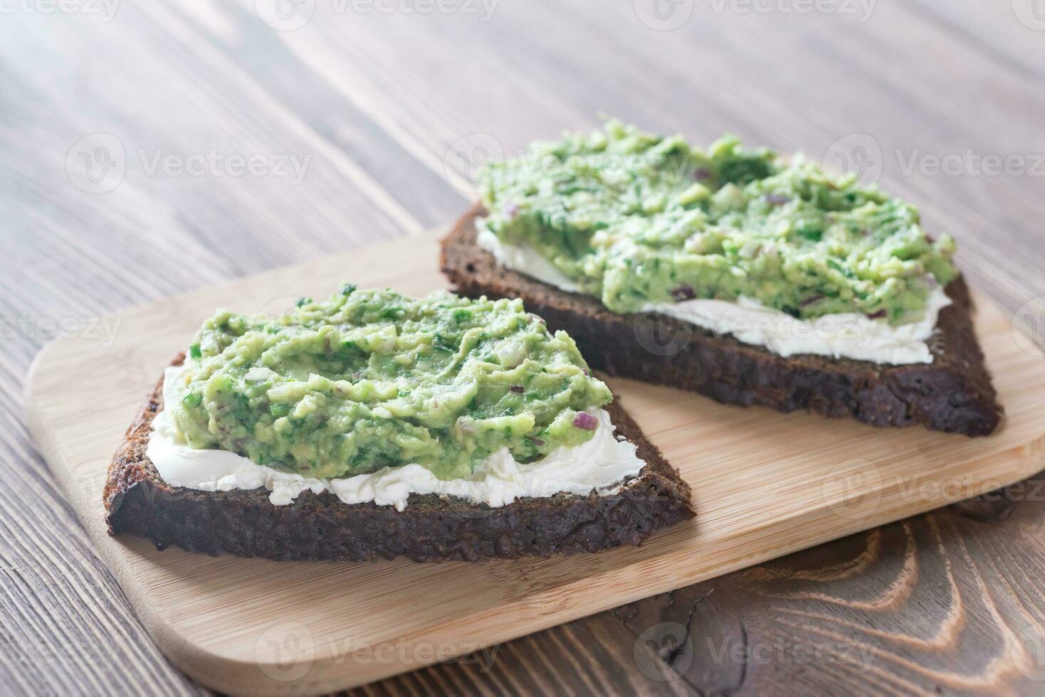 Toasts with cream cheese and guacamole photo