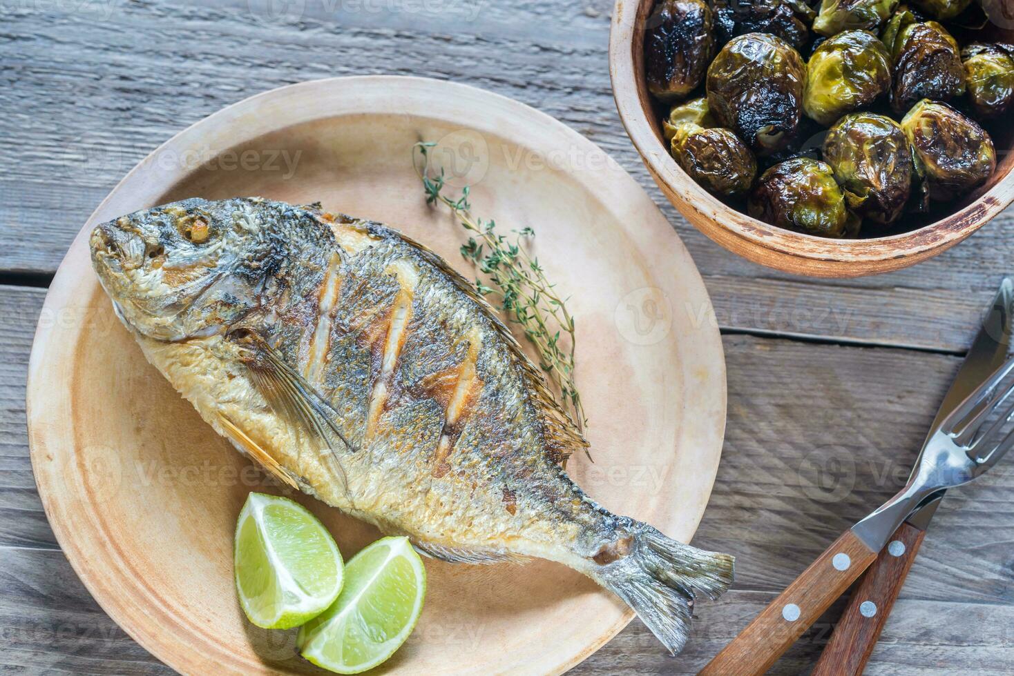 Grilled Dorade Royale Fish with brussel sprouts photo