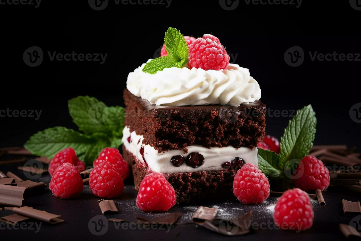 delicious chocolate cake with raspberries and herbs on a dark table. Chocolate cake. Wedding dessert. Birthday party. Delicious dessert. Traditional American dessert photo