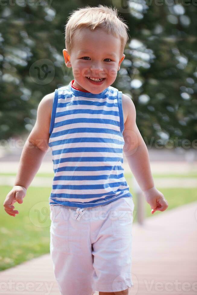 Portrait of smiling happy boy photo