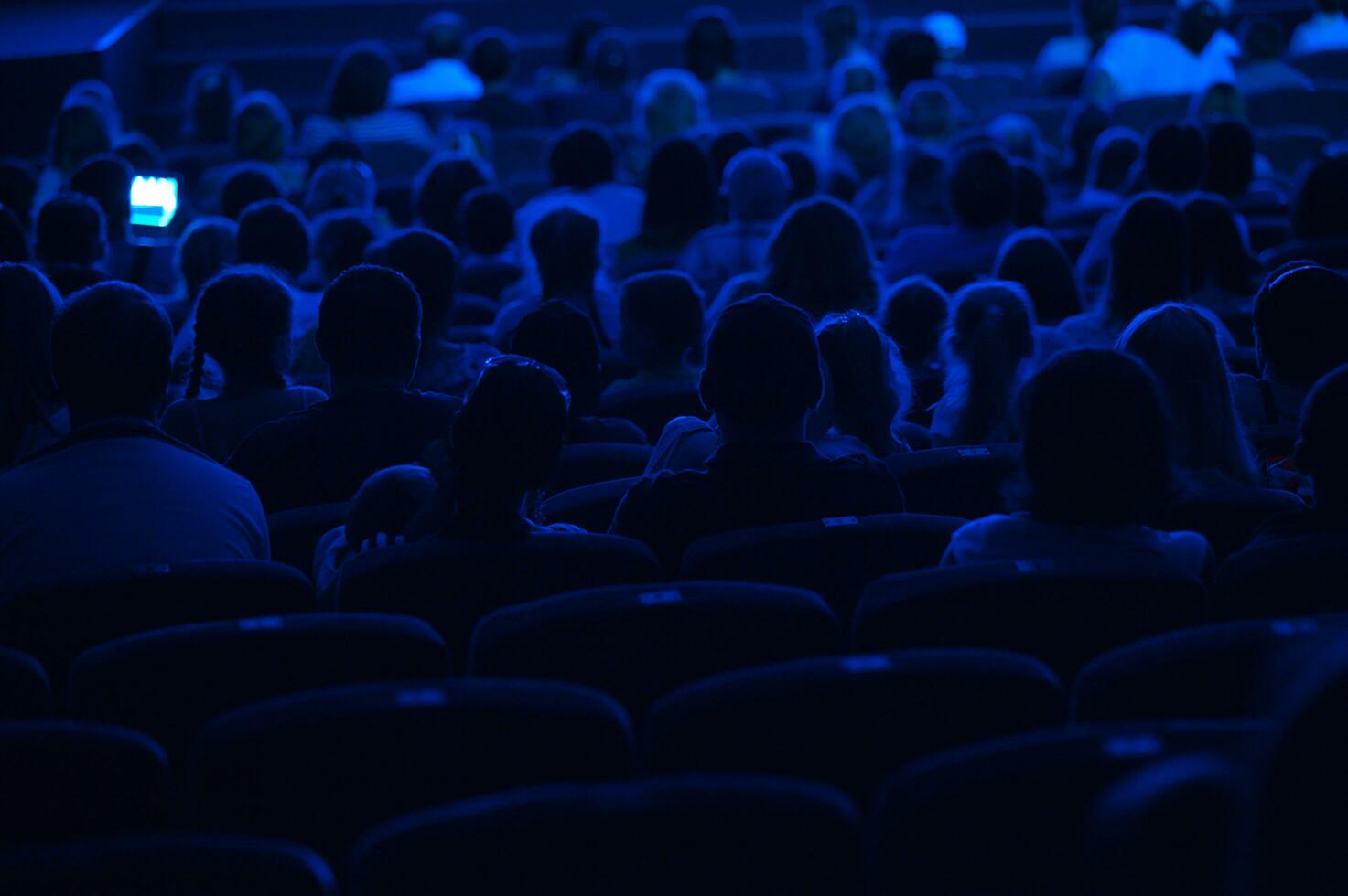 Audience in the cinema. Silhouette. photo