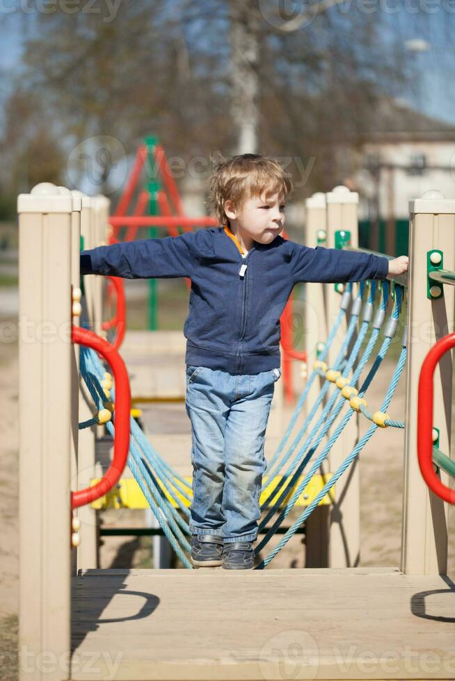 Young boy in the playground photo