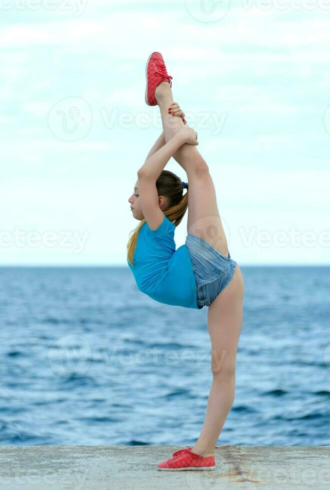 Girl stretching out outdoor photo