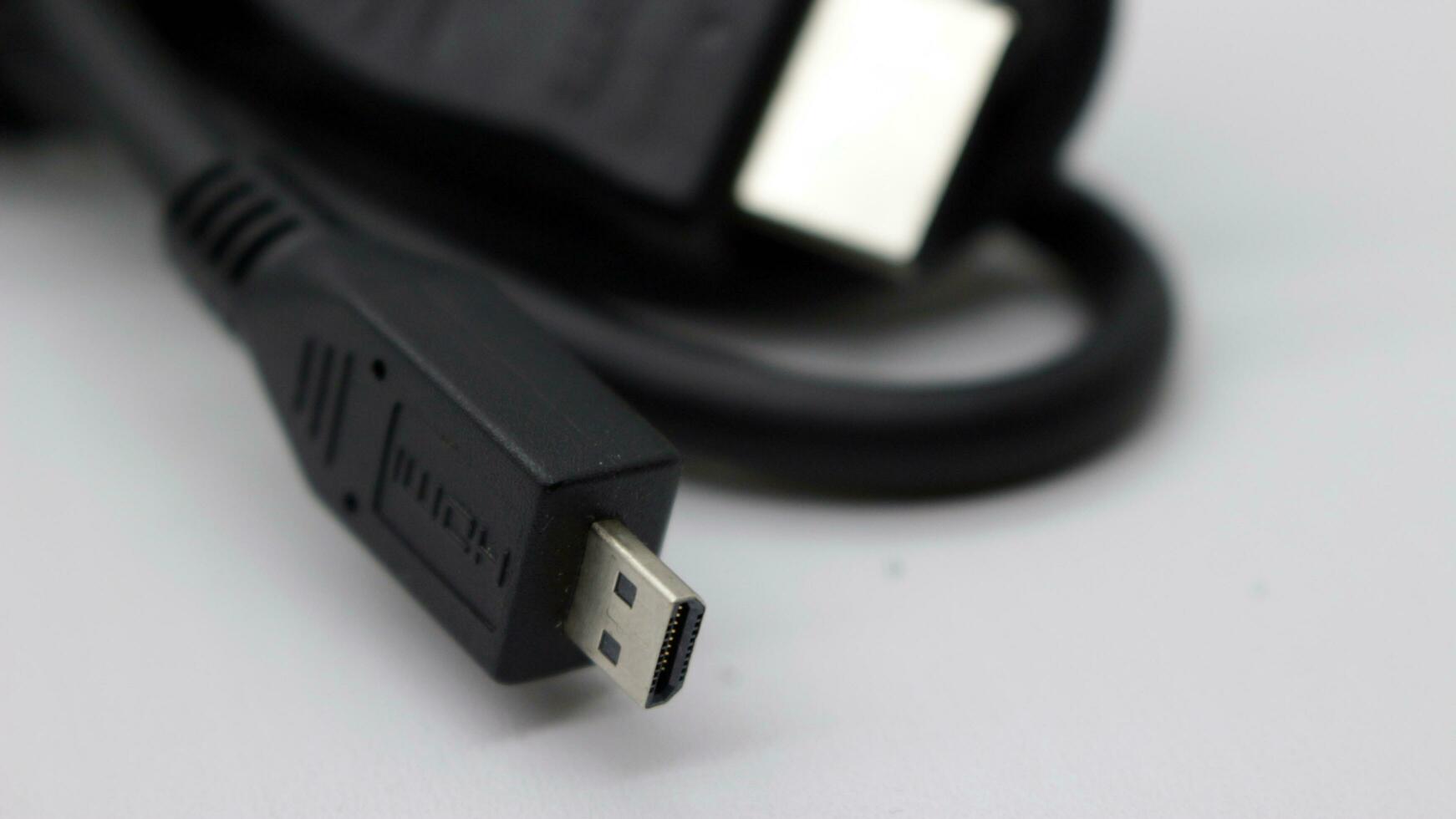 Black monitor cable that is neatly rolled photo
