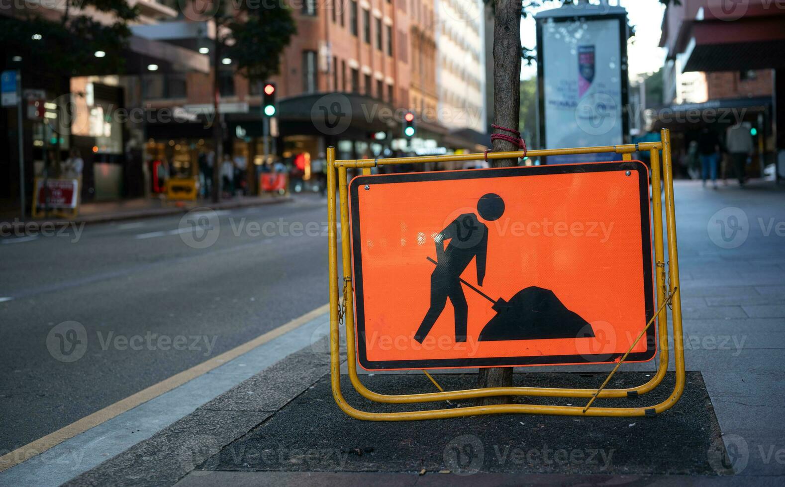 roadwork ahead sign located on street side in the city, driving carefully attention for road drive safety photo