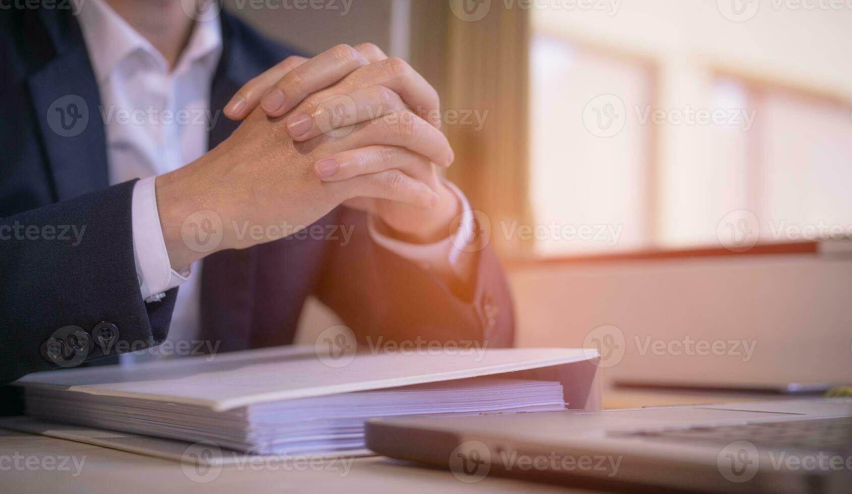 Hands of a thoughtful, hr recruiter making hiring decision at difficult job interview, opponents dialogue debate, business confrontation challenge concept, pray hope and negotiation business dealing photo